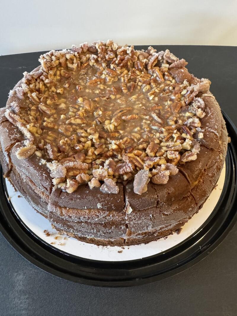 Maple Bourbon cheesecake by Linda's Specialty Cheesecakes, topped with a maple bourbon glaze and pecans.