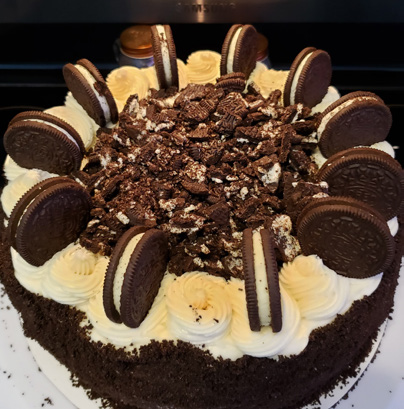 Oreo Blast cheesecake topped with Oreo cookies and whipped cream.
