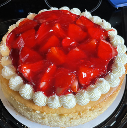 Strawberry cheesecake topped with sweet strawberries.