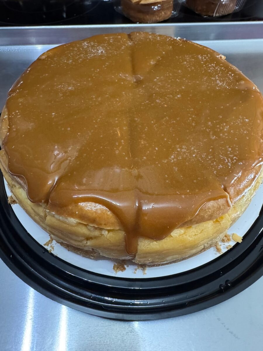 Cheesecake covered with a thick layer of golden salted caramel and a sprinkle of sea salt.